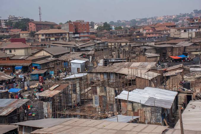 Bwaise rooftops meeting the Kampala skyline